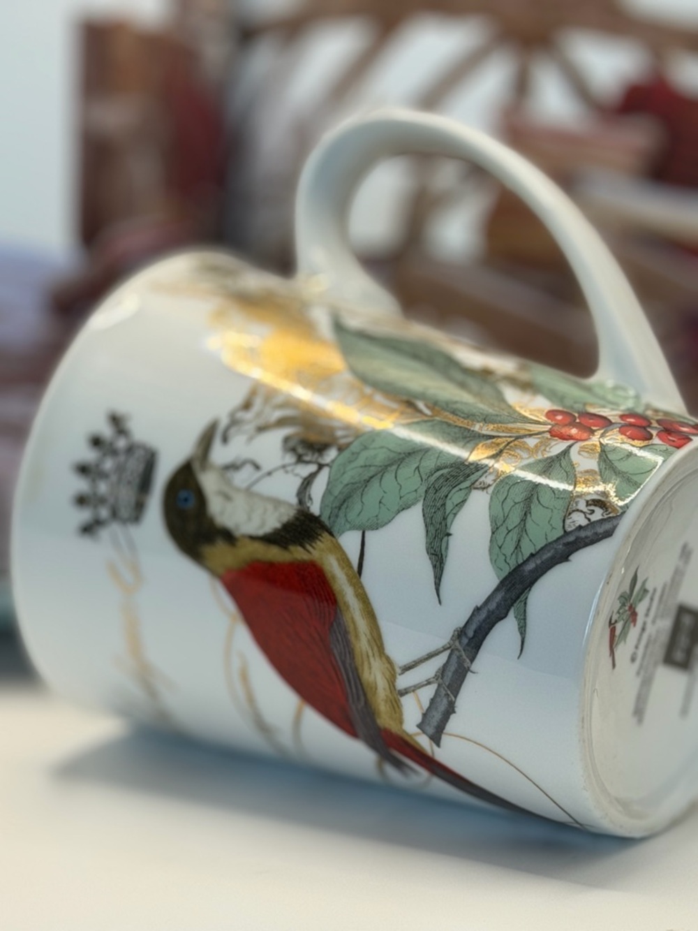 Fringe Studio White Porcelain Mug with Gold, Red and Green Bird Motif